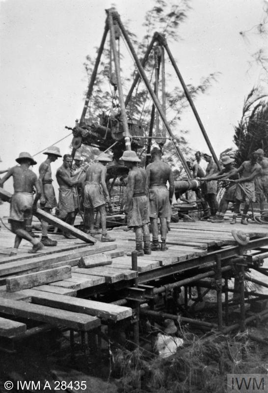 One of the big coastal defence guns being mounted at Addu Atoll